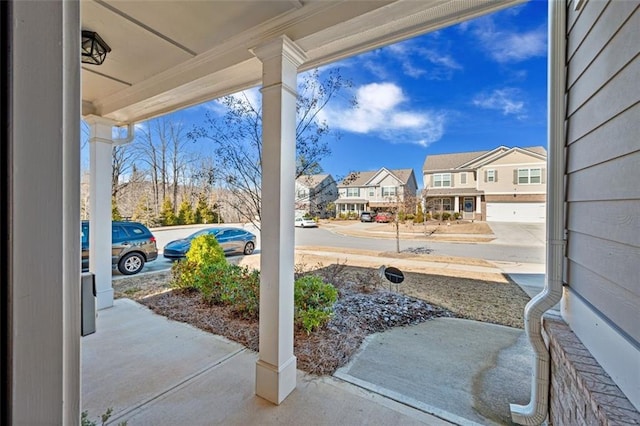 view of patio / terrace with a porch and a residential view