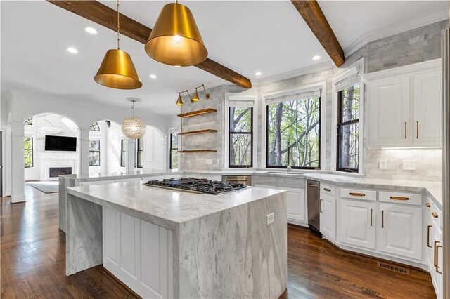 unfurnished dining area featuring ornamental molding, light wood-style floors, a decorative wall, and an inviting chandelier