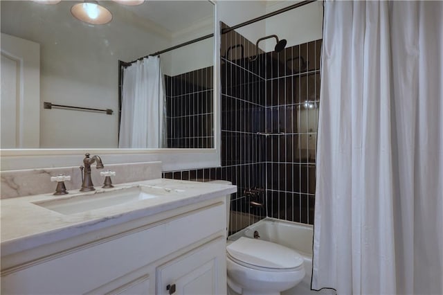 full bath featuring shower / bath combo, vanity, and toilet