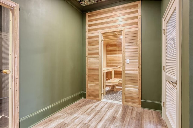 interior space featuring wood finished floors and baseboards