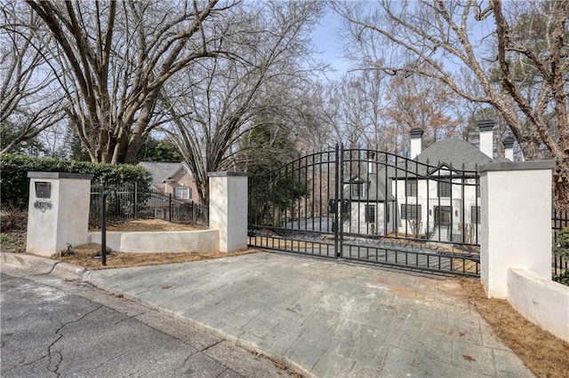 view of gate featuring a fenced front yard