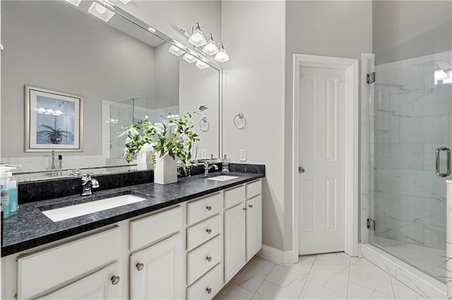 bathroom featuring vanity and a shower with door