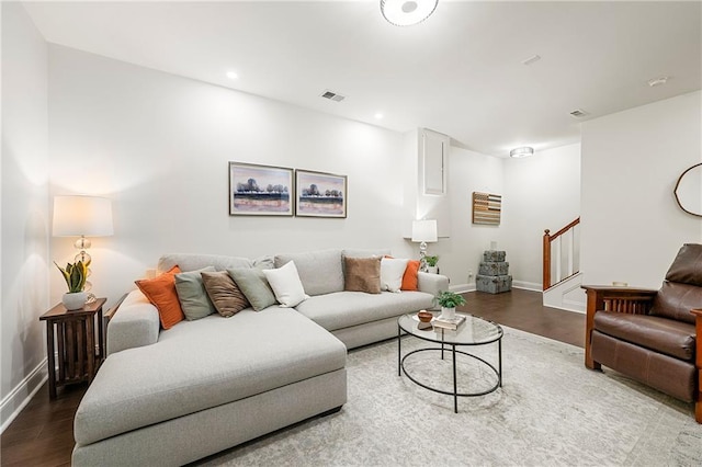 living room with dark hardwood / wood-style floors