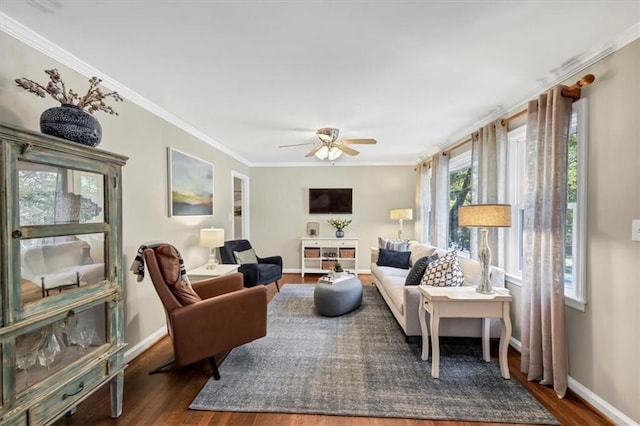 living room featuring crown molding, dark hardwood / wood-style floors, and ceiling fan