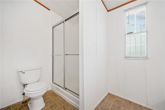 bathroom with toilet and a stall shower