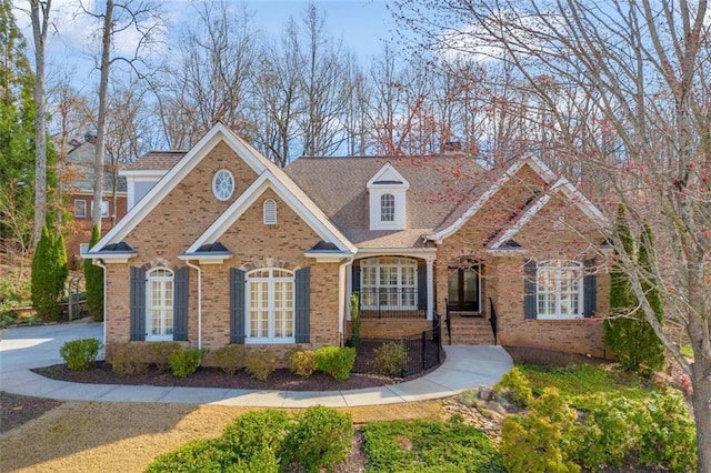 view of front of house with brick siding