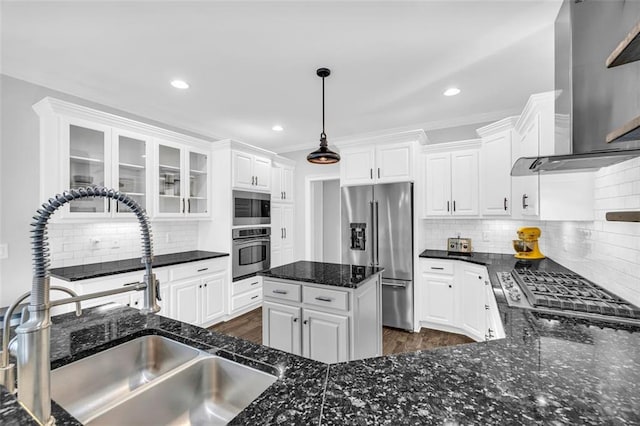 kitchen featuring appliances with stainless steel finishes, a sink, and white cabinets