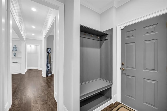 mudroom with dark wood-style floors, ornamental molding, baseboards, and recessed lighting