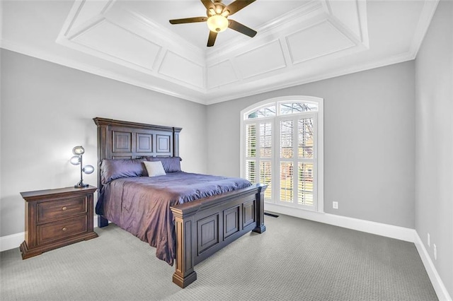 carpeted bedroom featuring ceiling fan, baseboards, coffered ceiling, and ornamental molding