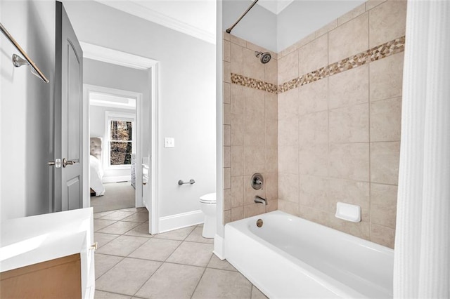 bathroom with crown molding, toilet, shower / tub combo, tile patterned flooring, and baseboards