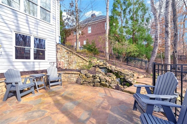 view of patio featuring fence