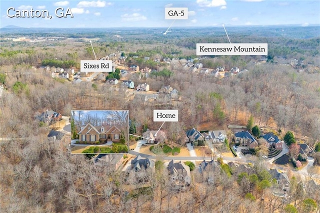 aerial view featuring a view of trees