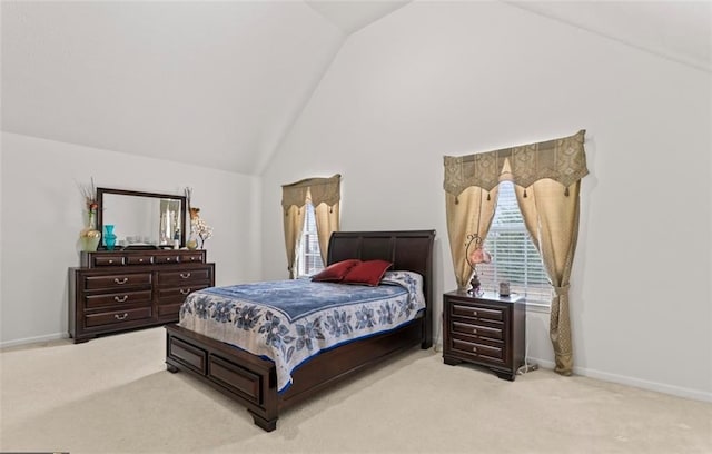 bedroom featuring light carpet and high vaulted ceiling