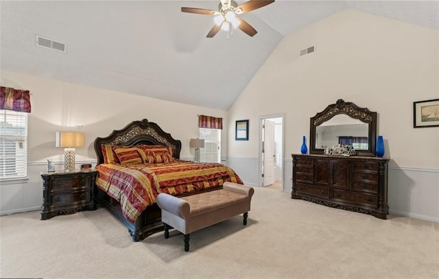 carpeted bedroom featuring ceiling fan and high vaulted ceiling