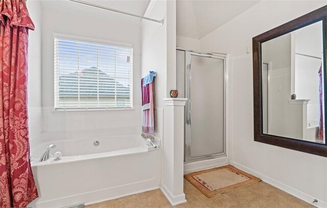 bathroom featuring independent shower and bath