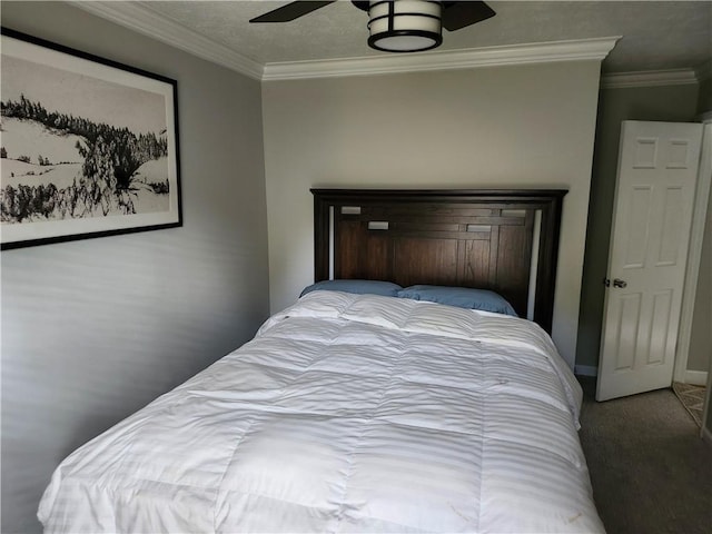 bedroom with carpet flooring, ceiling fan, and crown molding