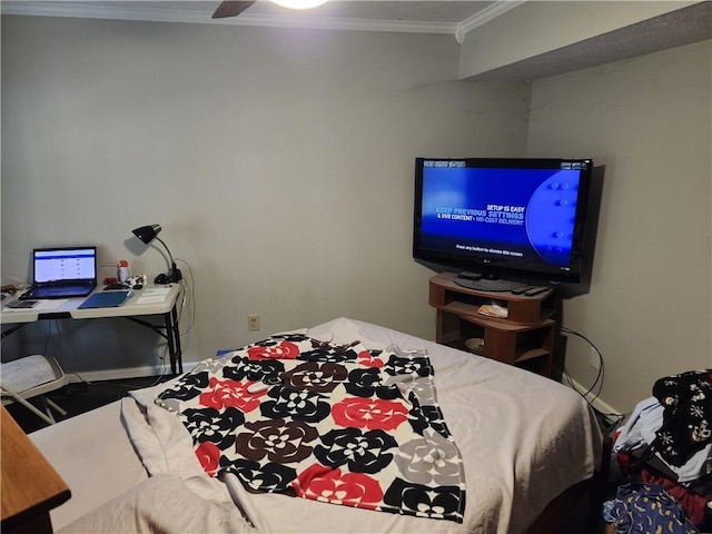 bedroom featuring ceiling fan and ornamental molding