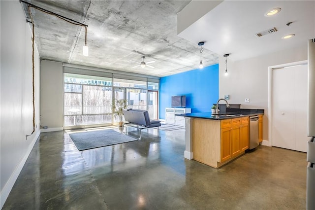 kitchen with concrete floors, a sink, visible vents, baseboards, and dishwasher