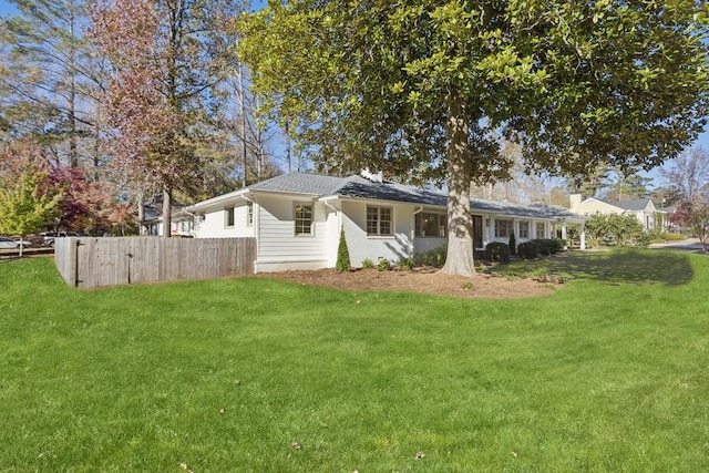 view of home's exterior with a lawn