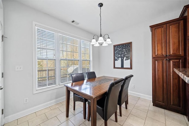 dining room with a chandelier, visible vents, baseboards, and light tile patterned floors