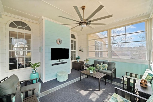 sunroom with a ceiling fan