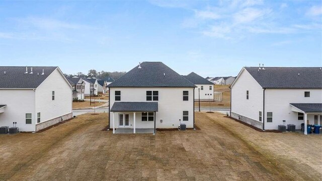 rear view of house featuring central air condition unit, french doors, and a patio