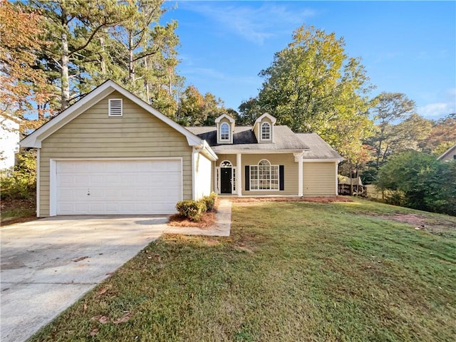 view of front of home with a front yard and a garage