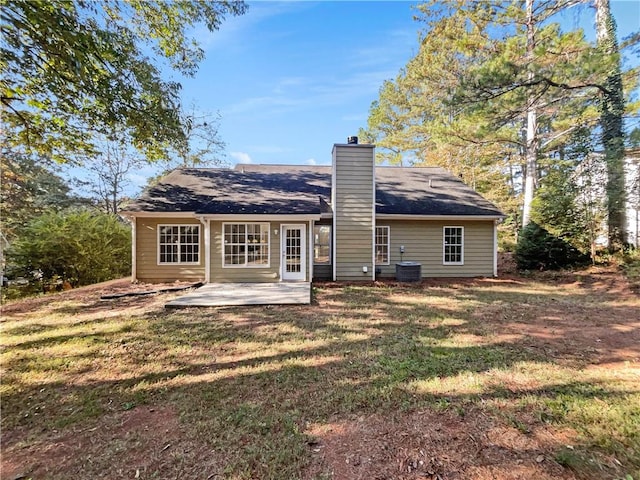 back of house with a yard, a patio area, and central AC unit