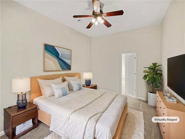 bedroom with light carpet and ceiling fan