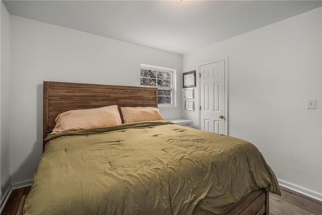 bedroom with wood-type flooring