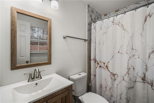 bathroom with vanity, toilet, and a shower with shower curtain