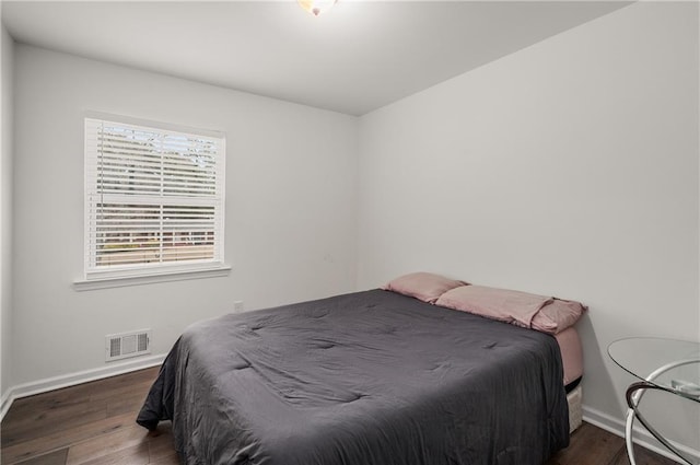 bedroom featuring dark wood-type flooring