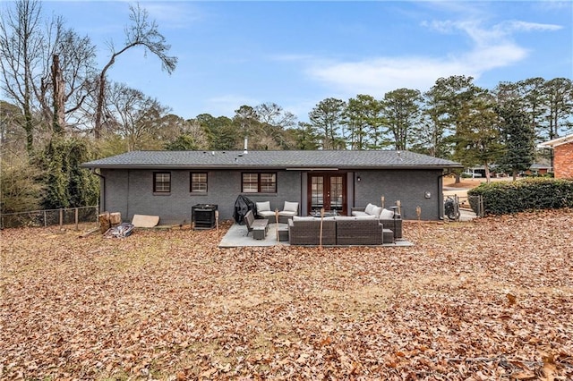 back of property featuring french doors, outdoor lounge area, central AC unit, and a patio