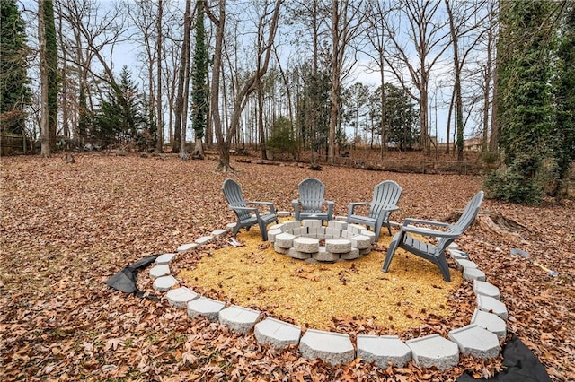 view of yard with an outdoor fire pit