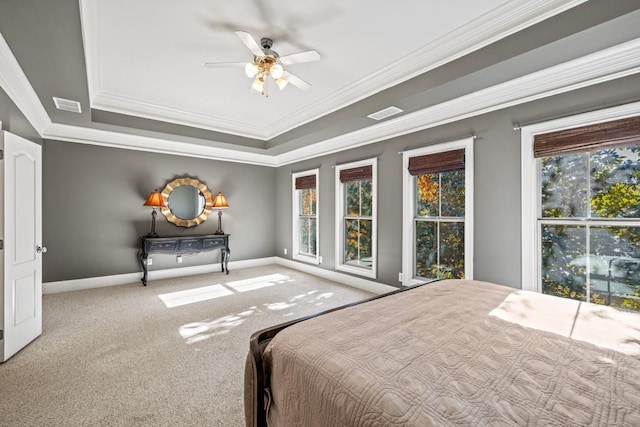 unfurnished bedroom with ceiling fan, light colored carpet, crown molding, and multiple windows