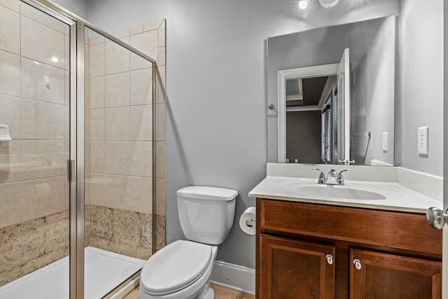 bathroom featuring walk in shower, vanity, and toilet