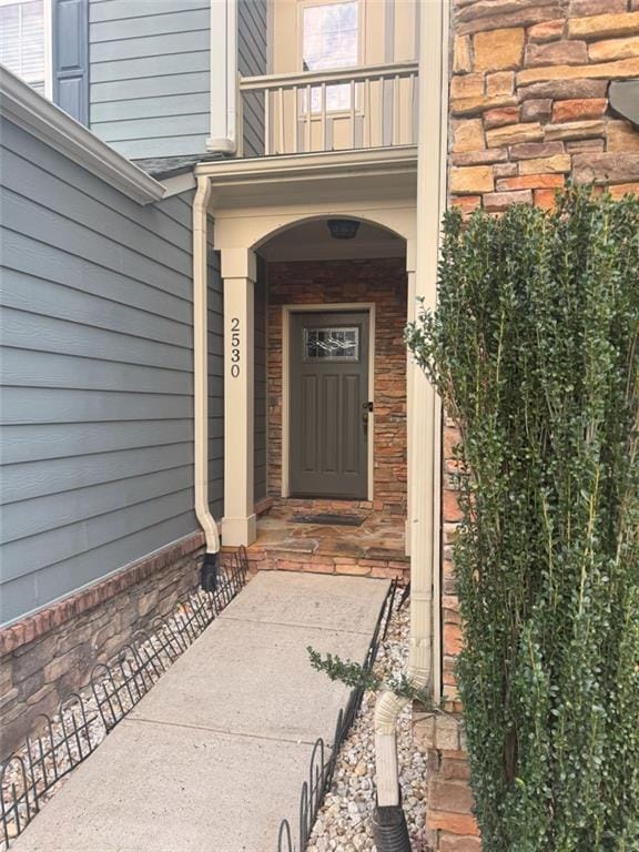 doorway to property featuring a balcony