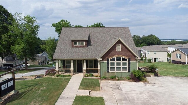 334 Glenn Abby Ln, Pendergrass, GA 30567 - view of front of home featuring a porch, a front yard, and roof with shingles