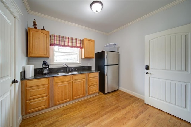 334 Glenn Abby Ln, Pendergrass, GA 30567 - kitchen featuring freestanding refrigerator, a sink, crown molding, light wood-type flooring, and baseboards