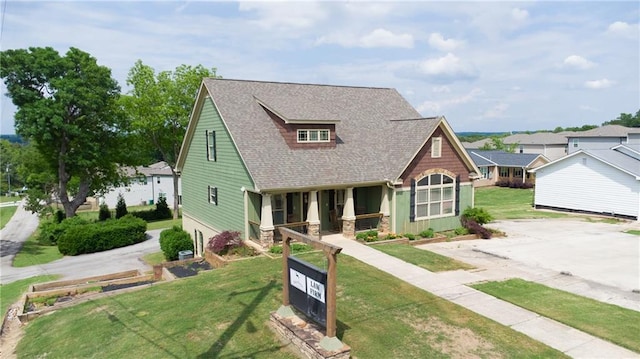 334 Glenn Abby Ln, Pendergrass, GA 30567 - view of front of house with roof with shingles, a front lawn, and covered porch