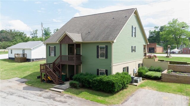 334 Glenn Abby Ln, Pendergrass, GA 30567 - view of front of home featuring a front lawn, stairway, roof with shingles, and central AC unit