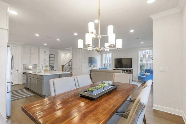 dining area with recessed lighting, stairway, ornamental molding, wood finished floors, and baseboards