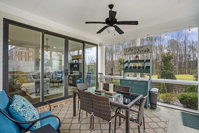 sunroom with a ceiling fan