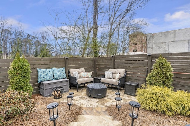 view of patio with a fenced backyard and outdoor lounge area