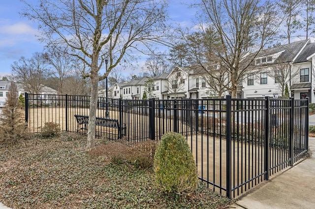 view of gate featuring a residential view and fence