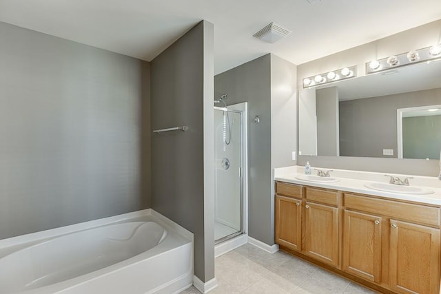 full bath with a sink, visible vents, and a shower stall