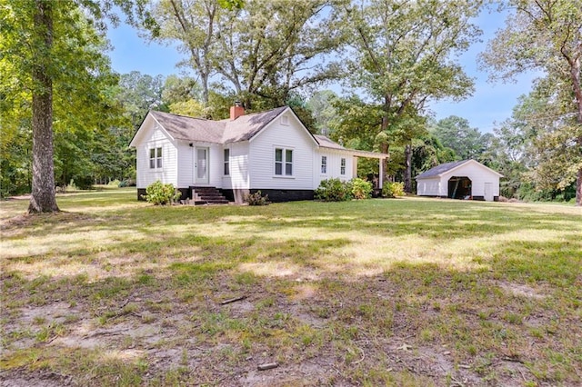 view of side of property with a yard