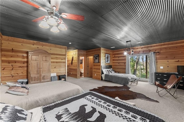 bedroom featuring wooden walls and light colored carpet