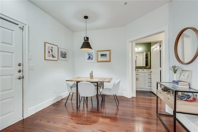 dining area featuring dark hardwood / wood-style flooring