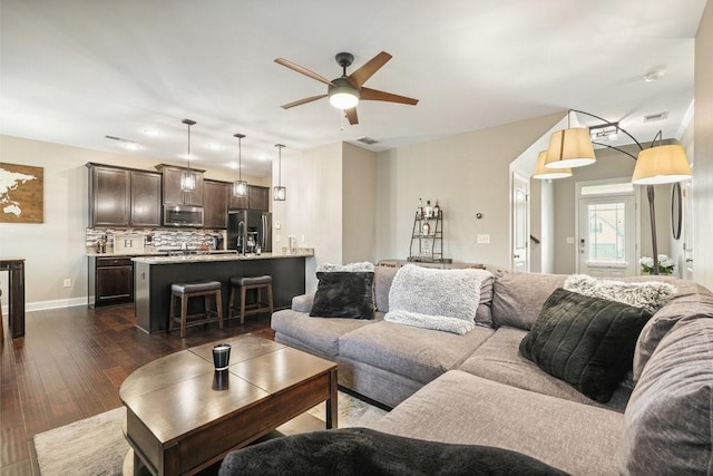 48 Ironwood Ct, Dallas, GA 30132 - living room featuring visible vents, dark wood finished floors, baseboards, and ceiling fan